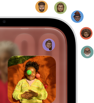 Closeup of Apple HomeView display, showing home screen with Apple app icons and photo. A user's Memoji icon is displayed in the top right corner of the HomeView display, with five additional Memoji icons appearing outside the display representing the ability to switch between multiple users
